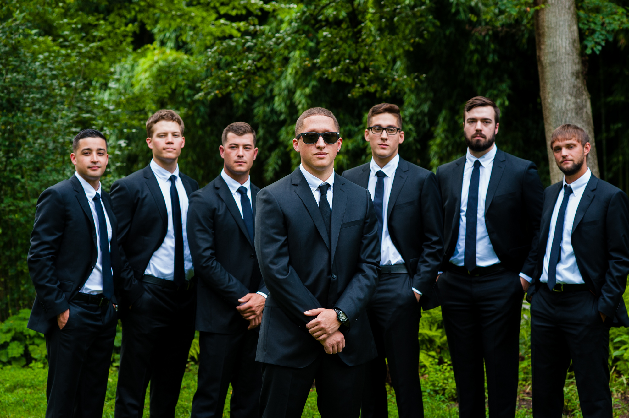 groom and groomsmen pose for portraits at the biltmore