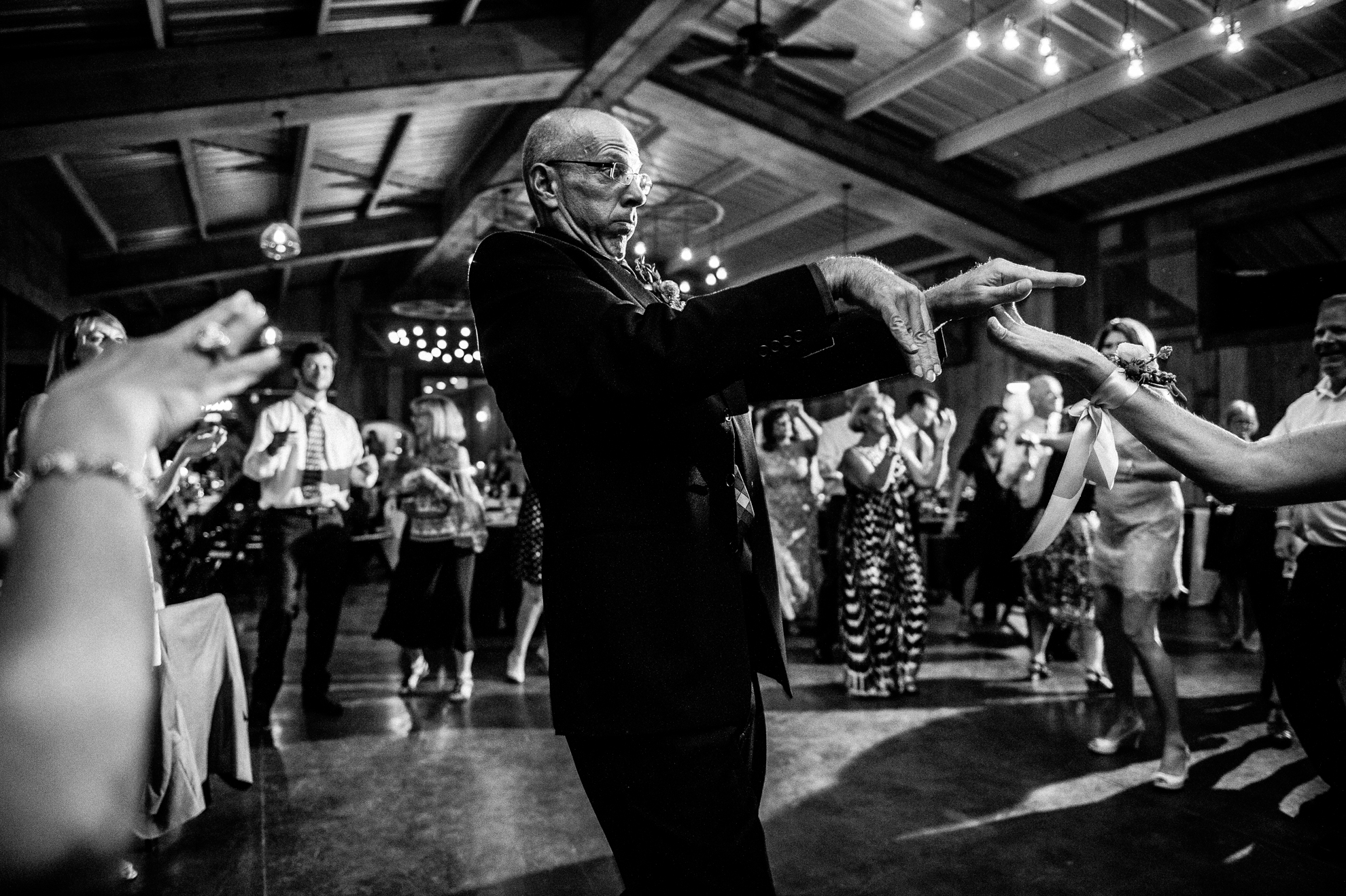 wedding guests enjoy a summertime party in the mountains 