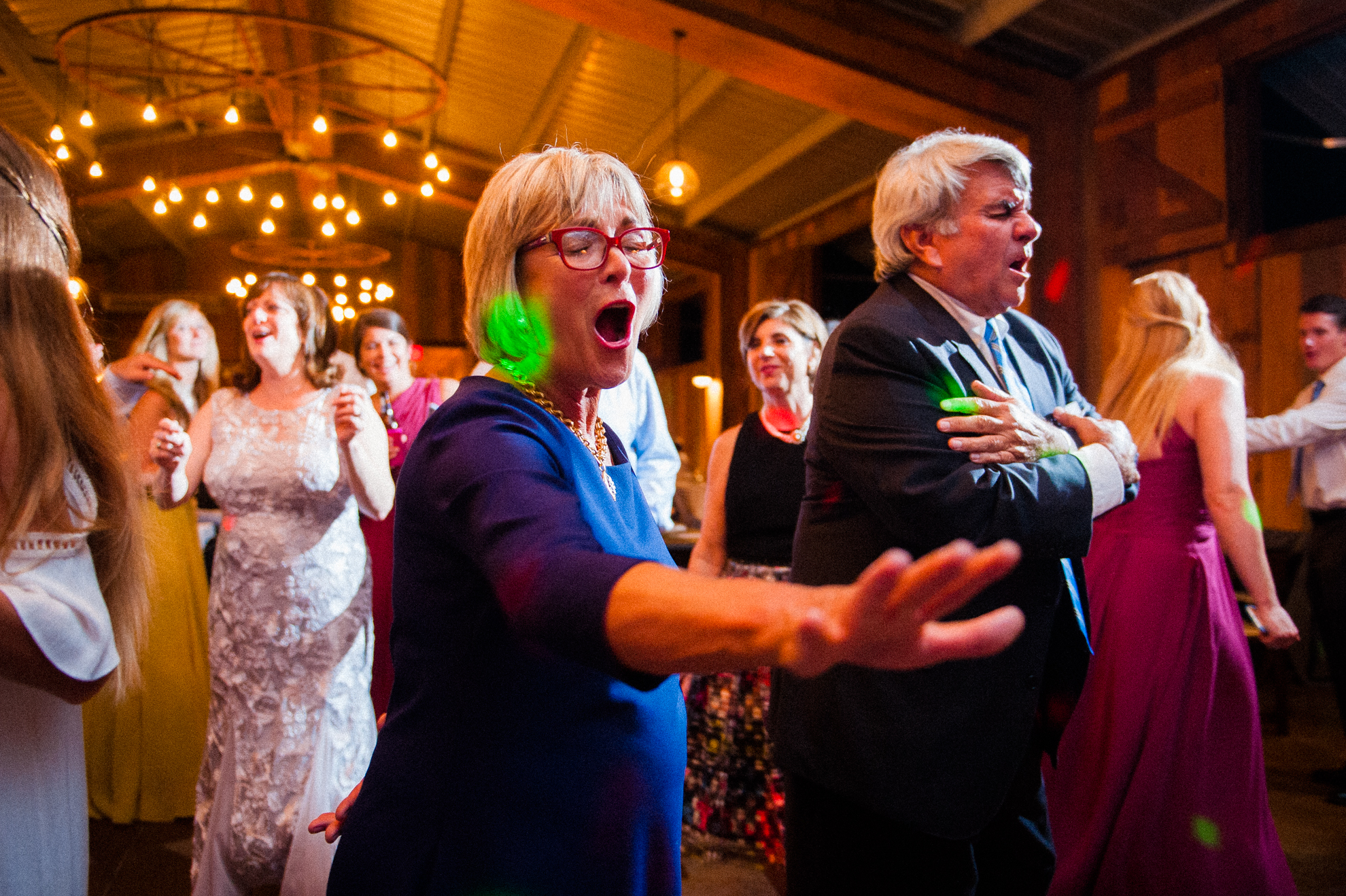 wedding guests dancing in the new vineyards at bettys creek reception barn 