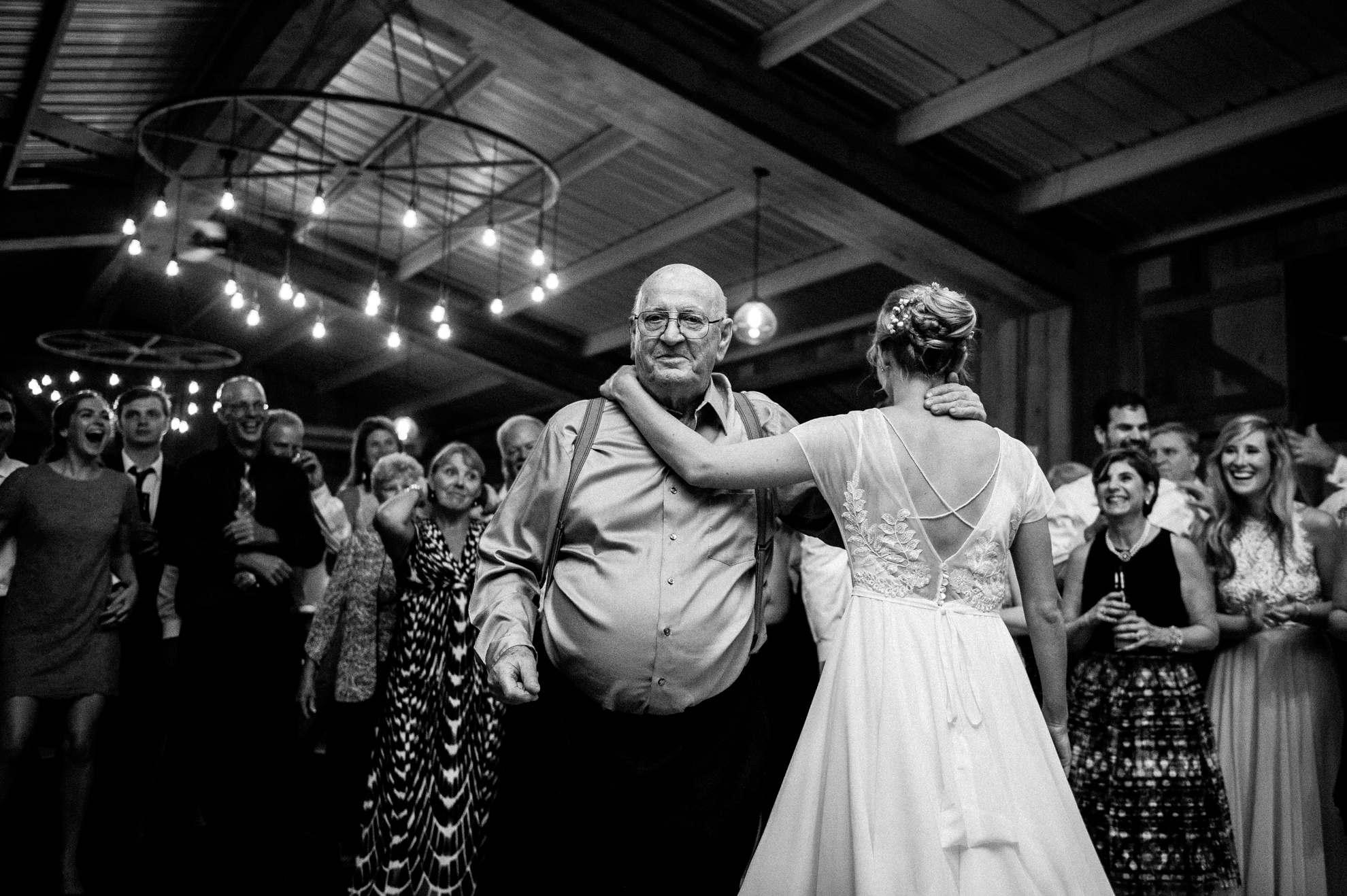 bride and grandfather dance during wedding reception in sylva nc 