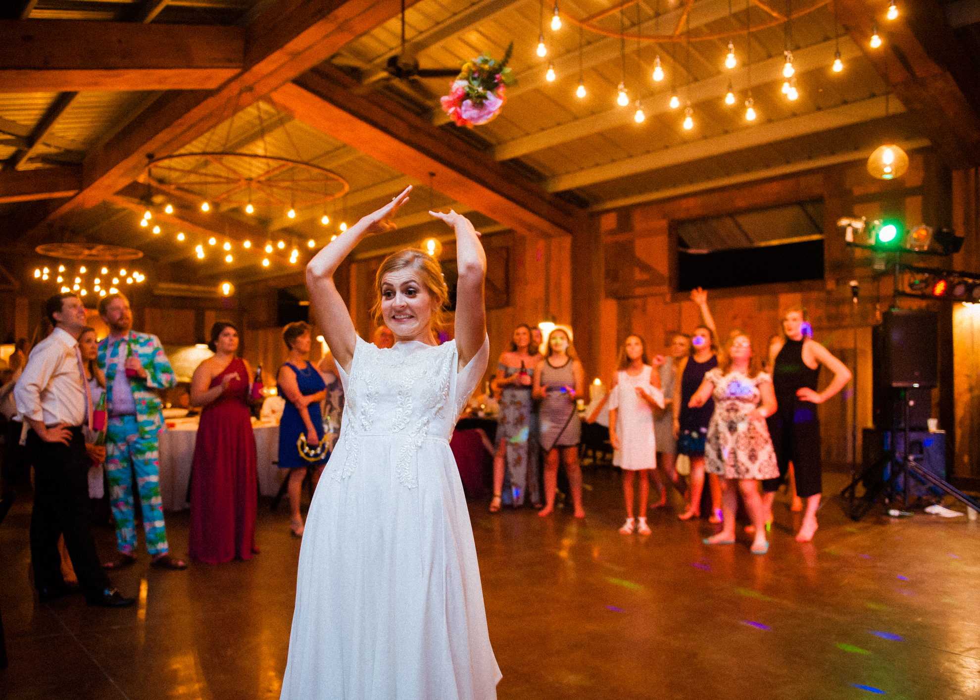 bouquet toss at vineyards at bettys creek wedding 