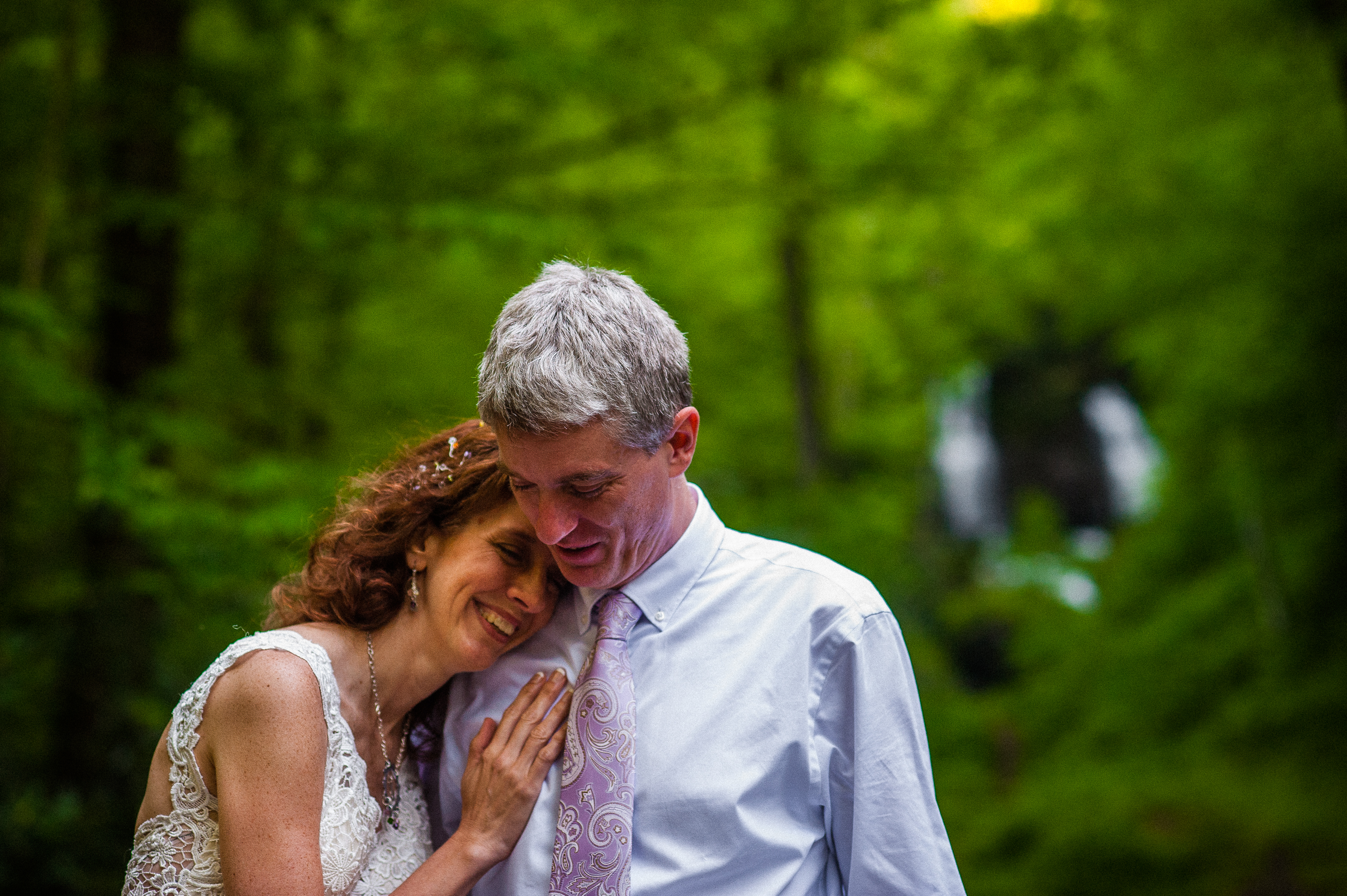 bride and groom by the waterfall at REEB Ranch 