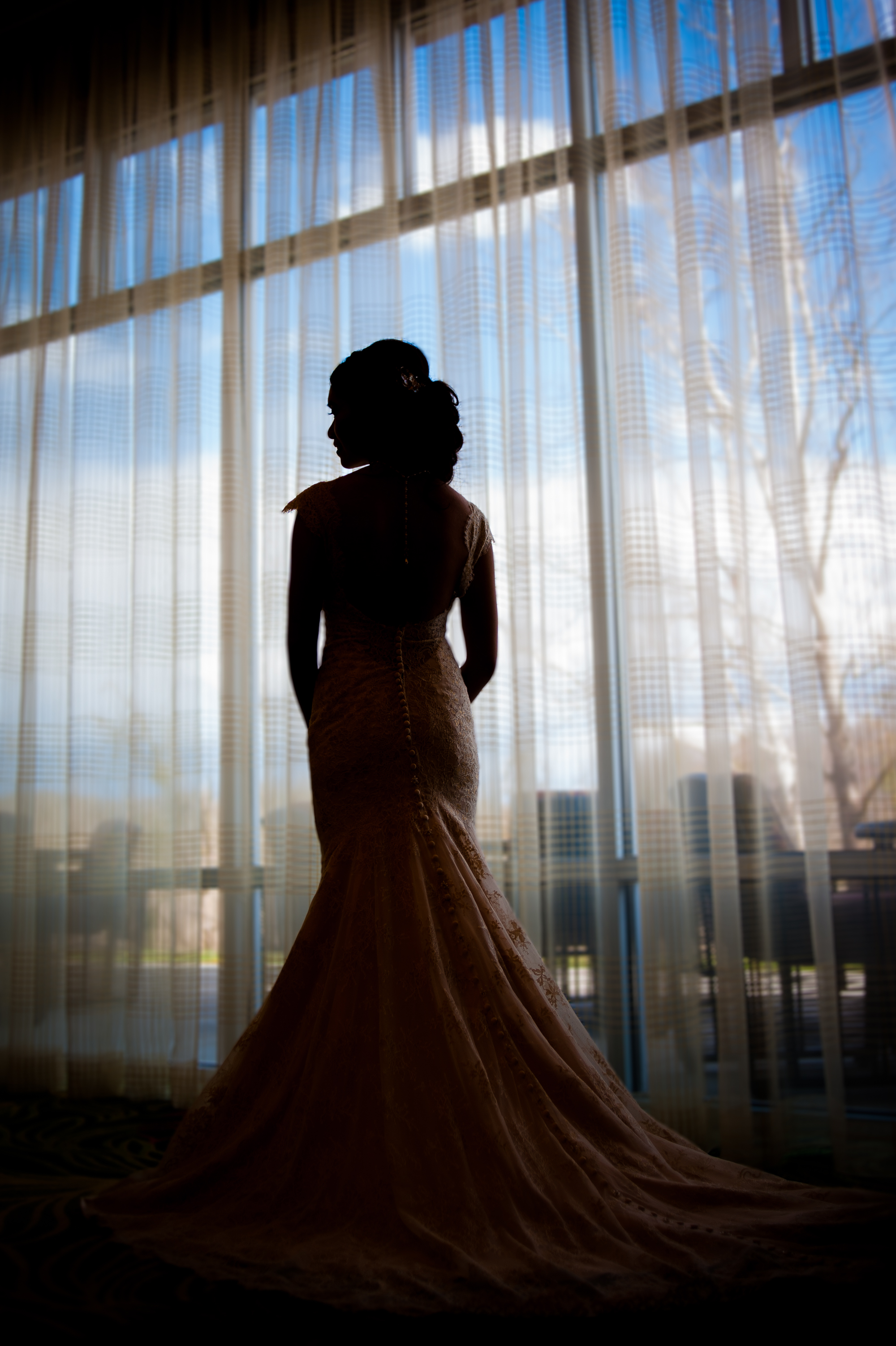 bride silhouet in asheville hotel window