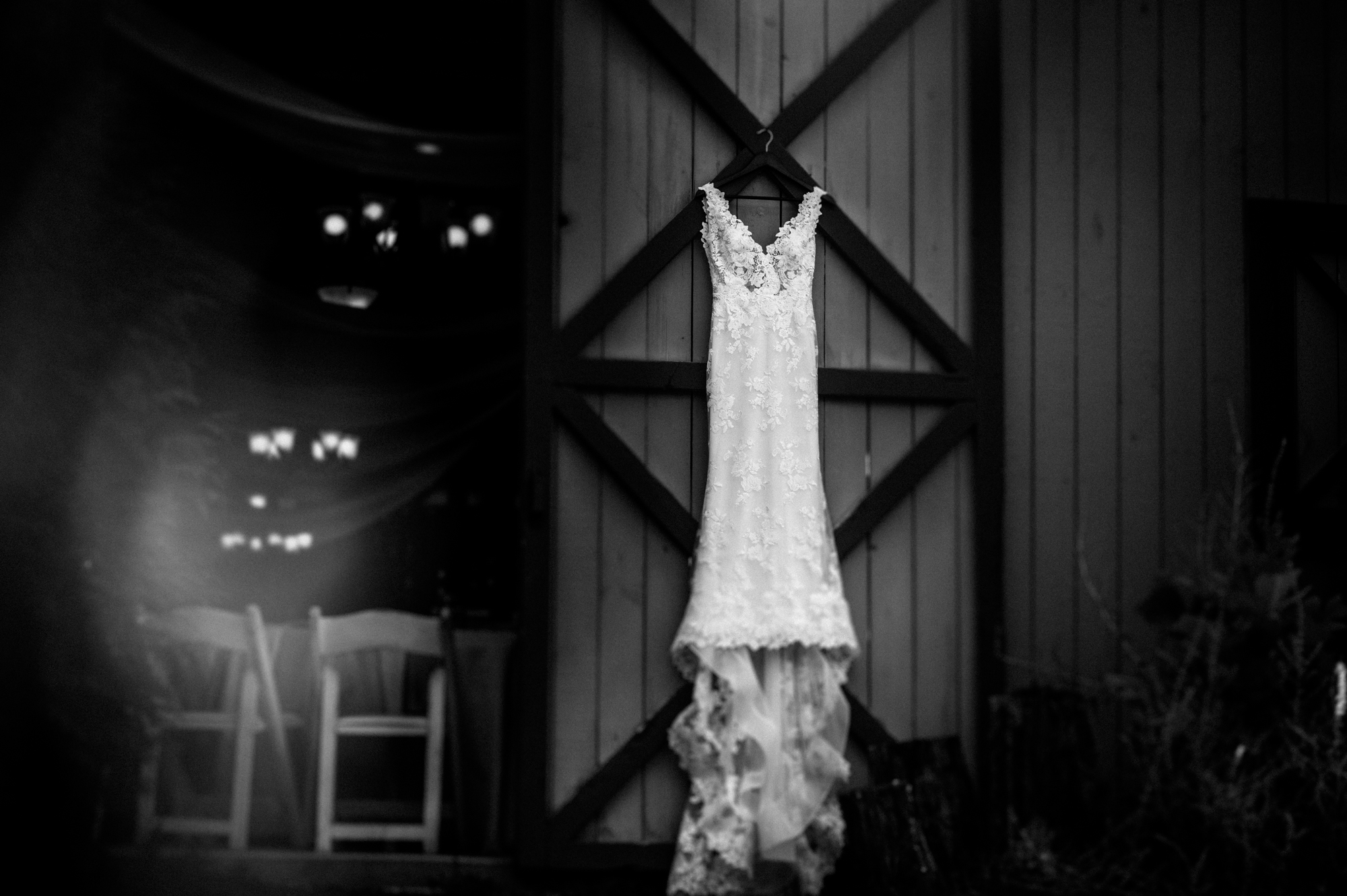 wedding dress hanging from a barn in asheville