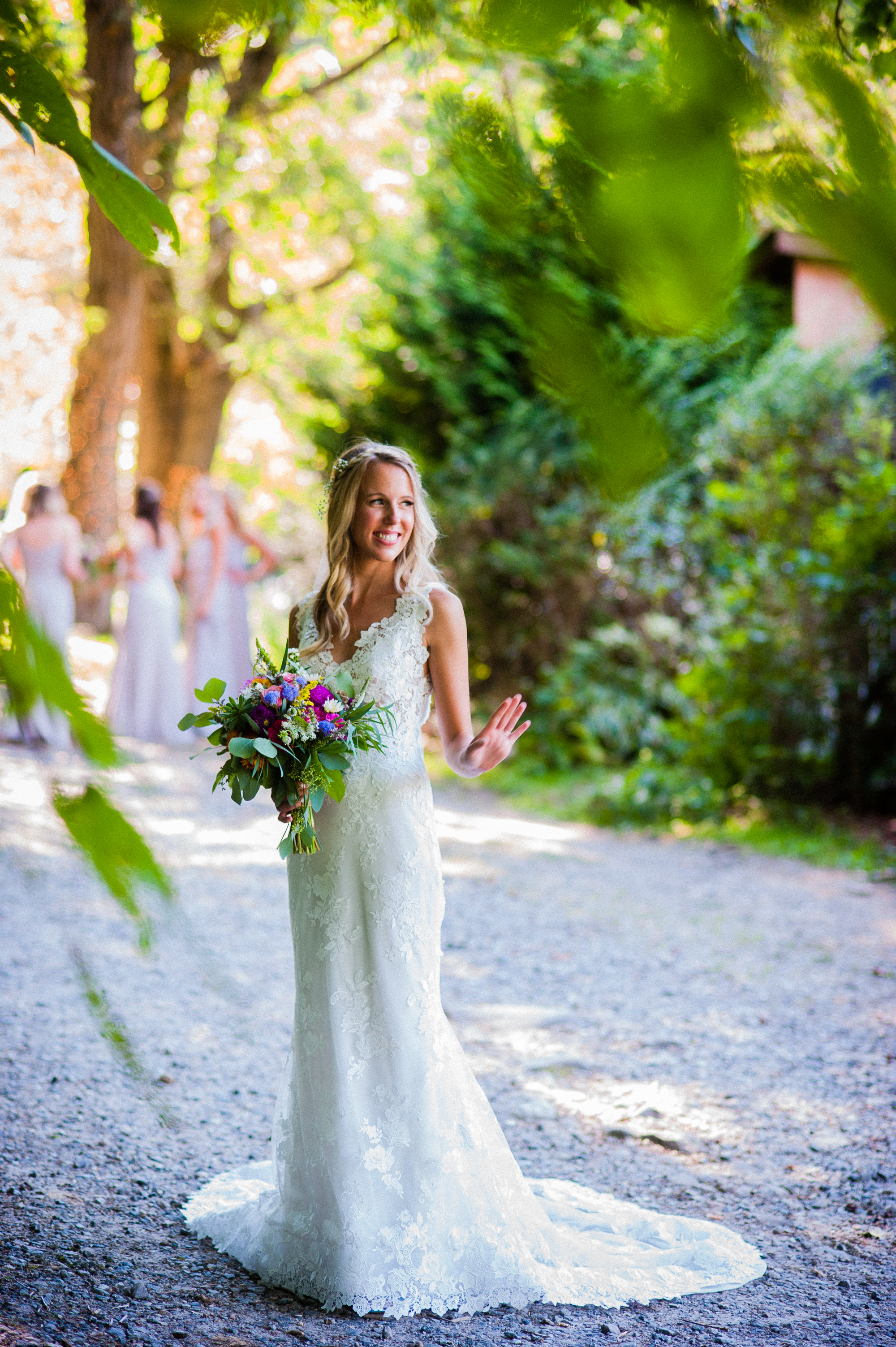 beautiful asheville bride waving at guests