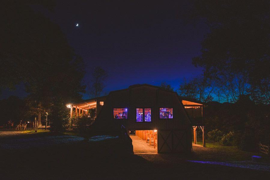 Asheville wedding venue Yesterday Spaces lit up at night during a reception