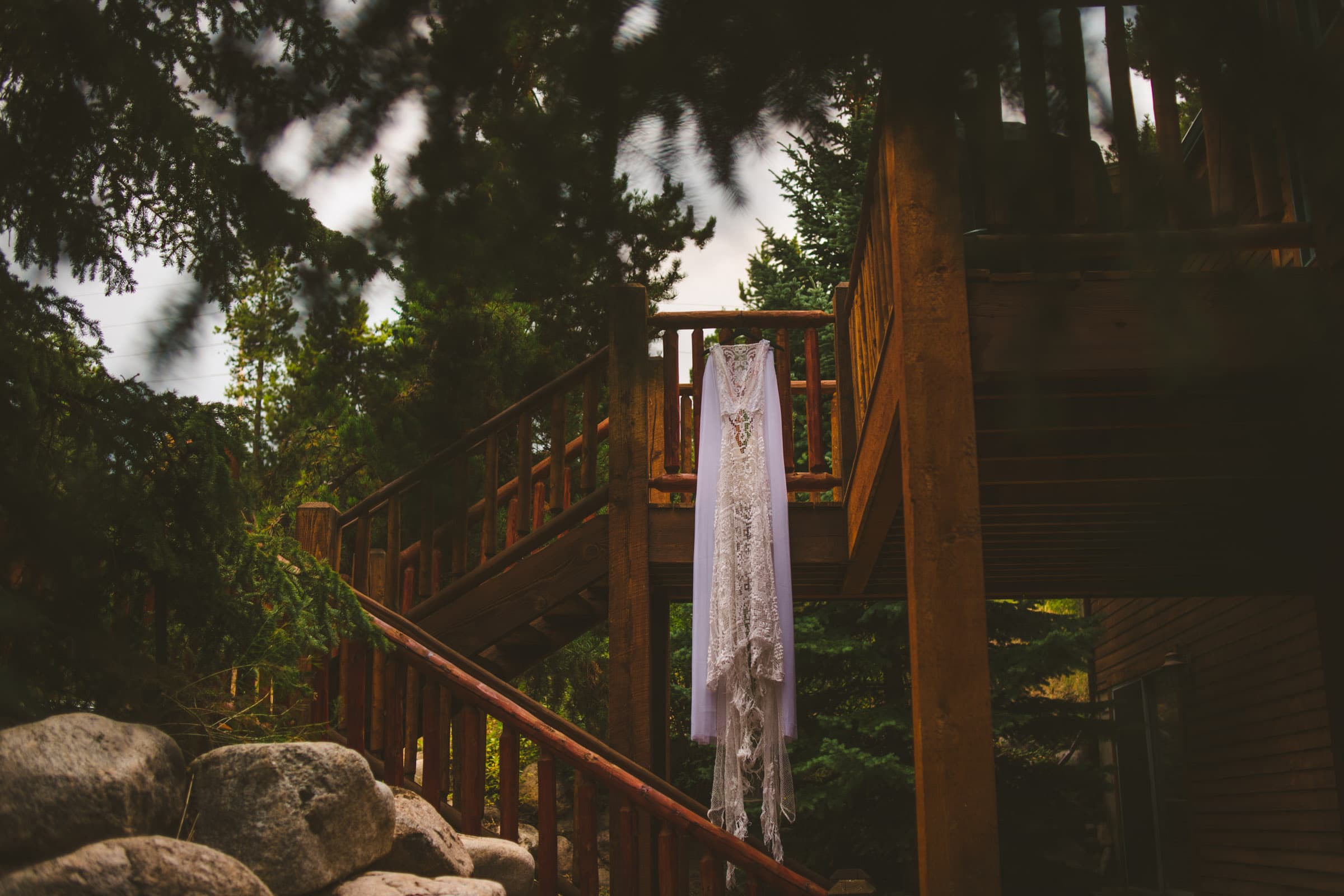 Wedding dress hanging from lodge railing near Loveland Pass Colorado