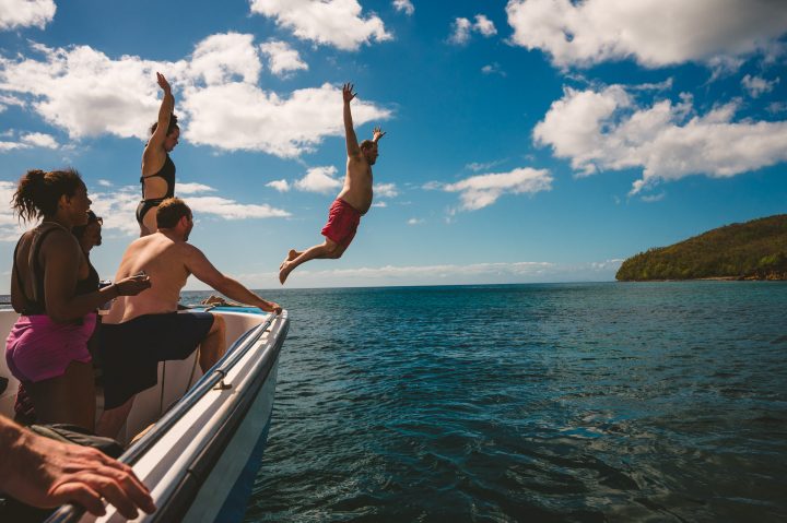 jumping in the water during a st lucia elopement 